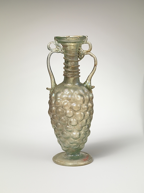 Roman glass bottle moulded in the shape of a bunch of grapes, fourth century CE.